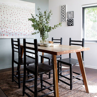 Scandinavian separate dining room in Melbourne with white walls, dark hardwood floors and brown floor.