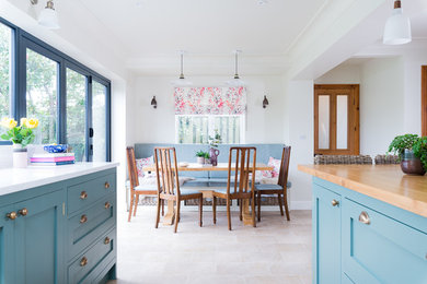 This is an example of a traditional dining room in Other with vinyl flooring and beige floors.