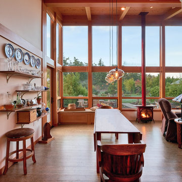 The TimberCab's wall of windows frames the view from the open living area.