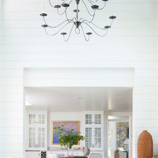 Huge transitional enclosed dining room photo in Portland Maine with white walls