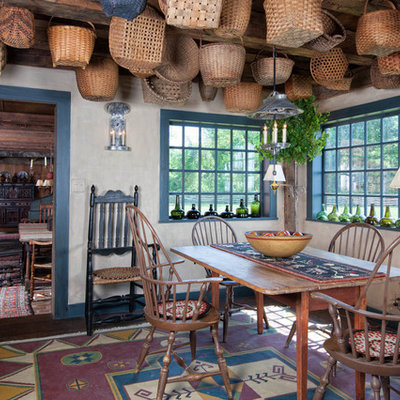 Enclosed dining room - country dark wood floor enclosed dining room idea in Boston with gray walls