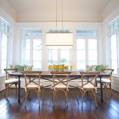 Elegant dark wood floor dining room photo in Dallas with beige walls