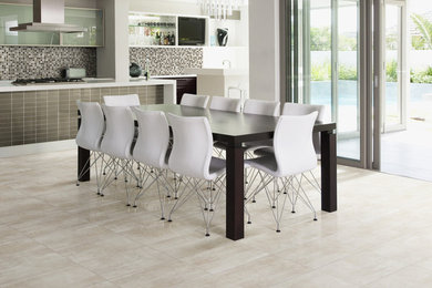 Inspiration for a mid-sized modern porcelain tile kitchen/dining room combo remodel in Houston with white walls