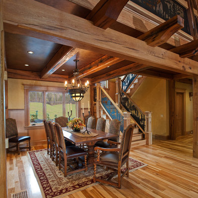 Inspiration for a rustic medium tone wood floor dining room remodel in New York with beige walls