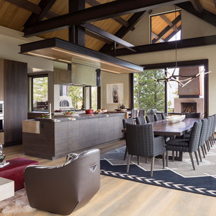 Great room - rustic light wood floor great room idea in Denver with beige walls and no fireplace