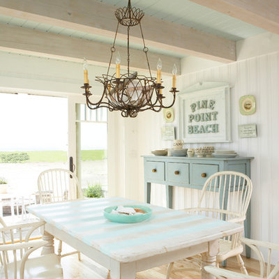 Kitchen/dining room combo - mid-sized coastal light wood floor and brown floor kitchen/dining room combo idea in Tampa with white walls