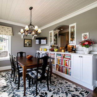 Example of a classic dining room design in Other with gray walls