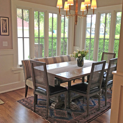 Example of a classic medium tone wood floor dining room design in Chicago with beige walls