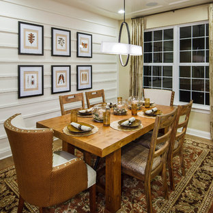Elegant medium tone wood floor dining room photo in Philadelphia with white walls