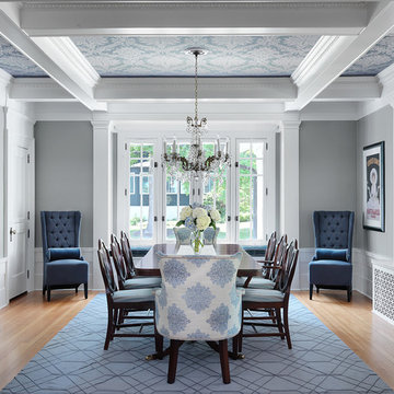 Traditional dining room with wall papered ceiling