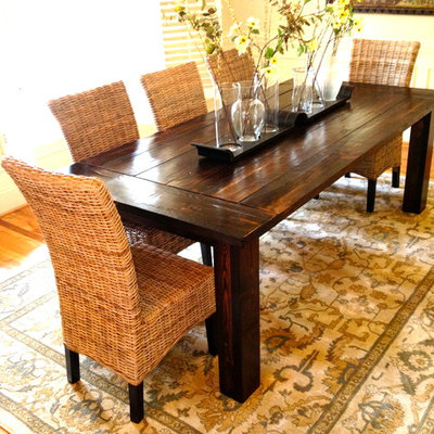 Example of a mid-sized farmhouse light wood floor enclosed dining room design in Raleigh with beige walls and no fireplace