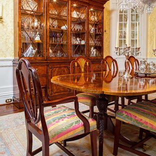 Inspiration for a mid-sized victorian dark wood floor enclosed dining room remodel in Atlanta with green walls and no fireplace