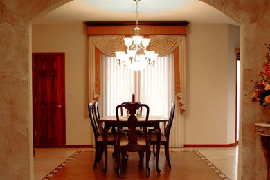 Example of a mid-sized classic ceramic tile enclosed dining room design in New York with beige walls and no fireplace