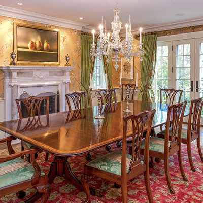 Inspiration for a large timeless dark wood floor enclosed dining room remodel in Toronto with multicolored walls and a standard fireplace