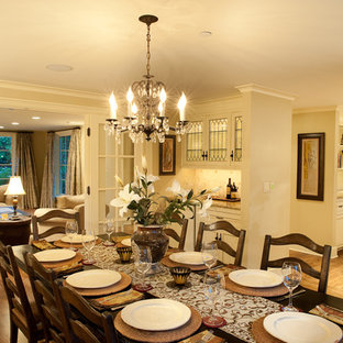 Inspiration for a mid-sized timeless medium tone wood floor enclosed dining room remodel in Seattle with beige walls and no fireplace