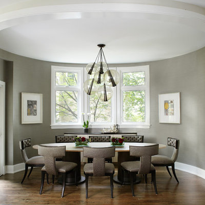 Example of a trendy dark wood floor enclosed dining room design in Chicago with gray walls