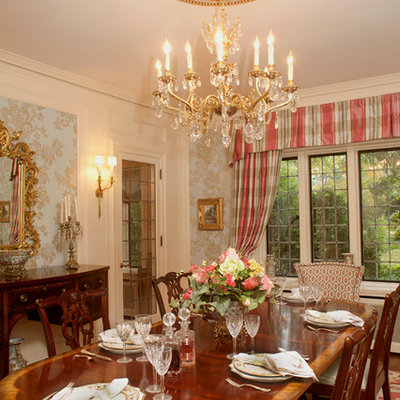 Example of a classic enclosed dining room design in Cleveland with white walls
