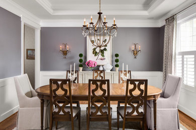 Enclosed dining room - large traditional medium tone wood floor enclosed dining room idea in DC Metro with gray walls and no fireplace