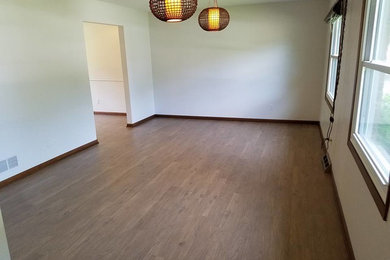 Mid-sized transitional medium tone wood floor enclosed dining room photo in Chicago with white walls and no fireplace