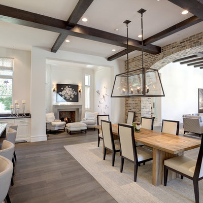 Example of a large transitional dark wood floor and white floor great room design in Dallas with white walls, a standard fireplace and a concrete fireplace
