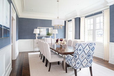 Transitional dark wood floor and brown floor dining room photo in New York with blue walls
