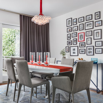 Eclectic White, Gray + Red Dining Room with Modern Light Fixture, Oval Dining Ta