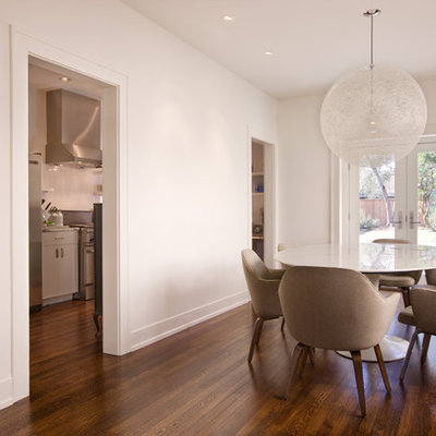 Dining room - contemporary dark wood floor dining room idea in Austin with white walls