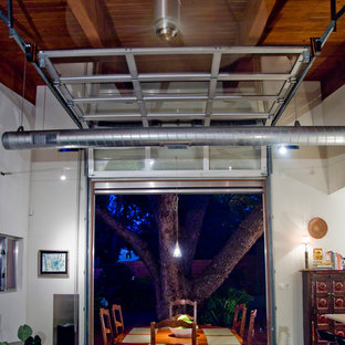Dining room - industrial concrete floor dining room idea in Other