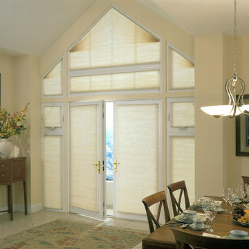 Triangular and trapezoid windows add interest to a dining room