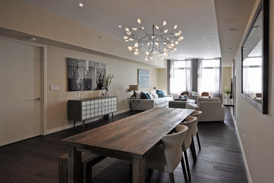 Large trendy dark wood floor great room photo in New York with beige walls