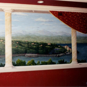 Trompe l'oeil mural with painted drapery that matches actual drapery in the room
