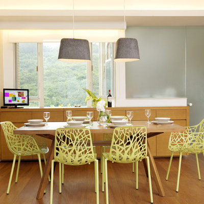 Dining room - tropical dining room idea in Hong Kong with white walls