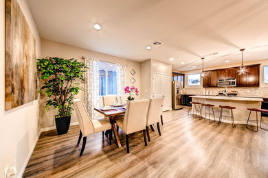 Example of a small transitional dark wood floor kitchen/dining room combo design in Las Vegas with beige walls and no fireplace