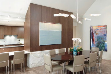 Example of a trendy limestone floor, beige floor, vaulted ceiling and wall paneling dining room design in Chicago with white walls