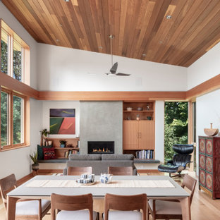 Foto di una sala da pranzo design con pareti bianche, parquet chiaro, camino classico, pavimento beige, soffitto a volta e soffitto in legno