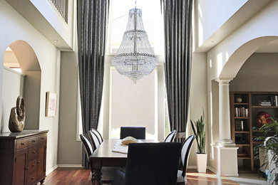 Two Story Tailored Pleat Drapes in an Elegant Dining Room