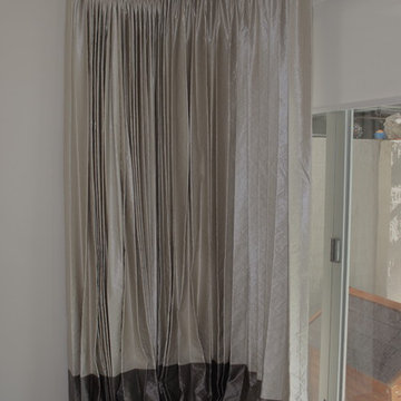 Two tone Curtains to create and interesting band of colour.  Contemporary Window
