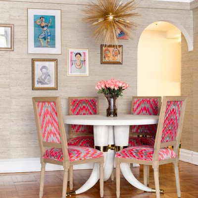 Inspiration for a mid-sized eclectic medium tone wood floor and brown floor great room remodel in New York with beige walls and no fireplace
