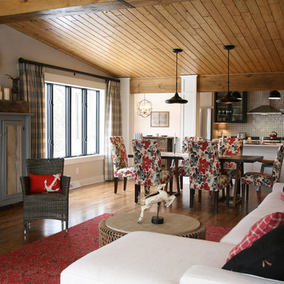 Inspiration for a mid-sized cottage medium tone wood floor kitchen/dining room combo remodel in Milwaukee with white walls and a standard fireplace