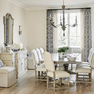 Example of a large tuscan light wood floor and beige floor dining room design in Phoenix with beige walls