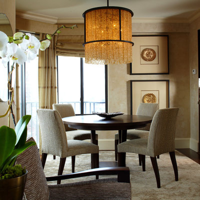 Example of a trendy dark wood floor kitchen/dining room combo design in New York with beige walls