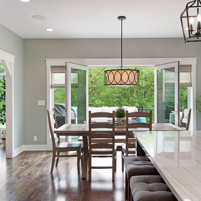 Inspiration for a mid-sized cottage dark wood floor and brown floor kitchen/dining room combo remodel in Kansas City with gray walls