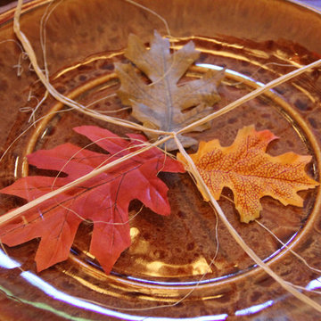 Using Raffia and Fall Leaves to jazz up your table for fall.