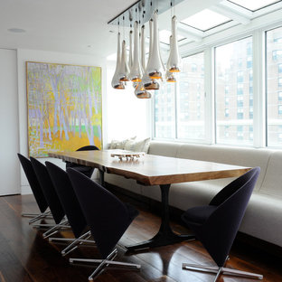 Minimalist dark wood floor dining room photo in Other with white walls