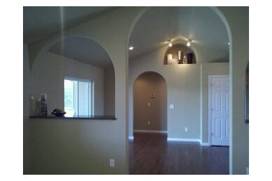 Vaulted ceiling with arched display shelf.