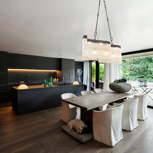 Photo of a large modern dining room in Cheshire with dark hardwood flooring and brown floors.
