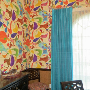 This is an example of a mid-sized tropical dining room in Orlando.