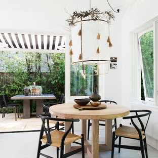 Design ideas for a country kitchen/dining combo in Sydney with white walls and grey floor.