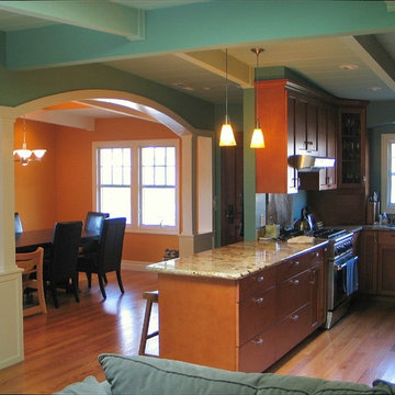 View of new dining room, entry hall, and kitchen, from central room.