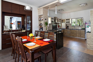 Example of a trendy dining room design in Bengaluru